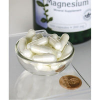 Thumbnail for Swanson Magnesium Oxide - 200 mg 500 capsules in a bowl next to a bottle.