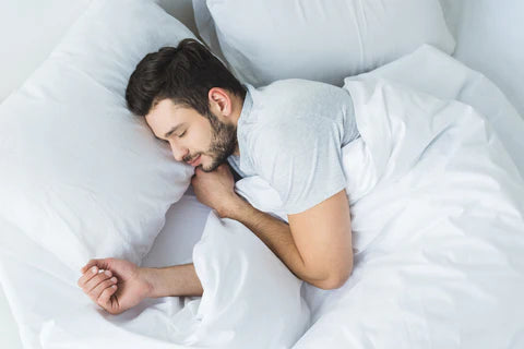 Man Sleeping in Bed