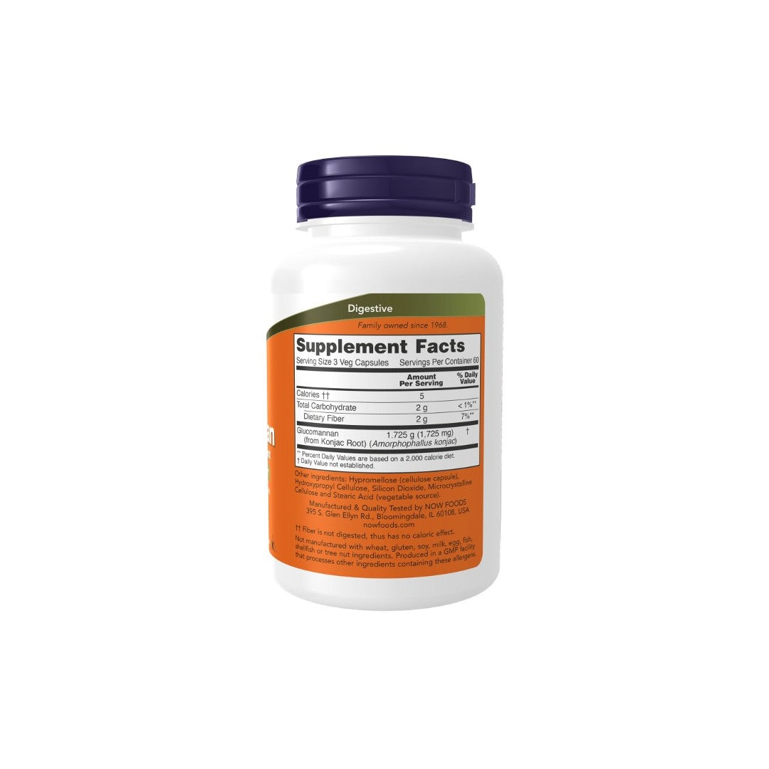 A bottle of Glucomannan 575 mg 180 Veg Capsules from Now Foods with an orange label displaying Supplement Facts, including ingredients and nutritional information for weight management. The bottle has a white body and a dark-colored cap.