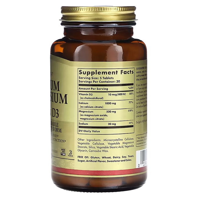 A brown bottle of Solgar's "Calcium Magnesium with Vitamin D3 150 Tablets" prominently displays a label detailing its ingredients and nutritional information, packed with potent essentials like magnesium, calcium, and vitamin D3 for optimal health support.