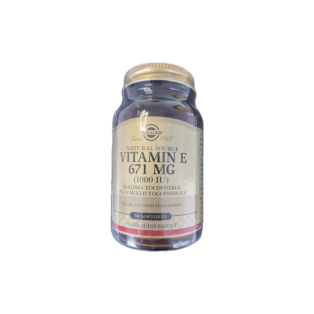 A clear glass bottle labeled "Vitamin E 671 mg (1000 IU) 50 Softgels" from Solgar. The label highlights its antioxidant properties, natural source D-alpha tocopherol plus mixed tocopherols, and notes that it is sugar, salt, and starch free—ideal for supporting heart health.