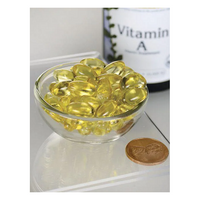 Thumbnail for A small glass bowl of yellow vitamin capsules sits beside a coin, promoting strong eyesight. A partially visible Swanson Vitamin A 10000 IU 250 Softgels bottle in the background hints at supporting a healthy immune system.