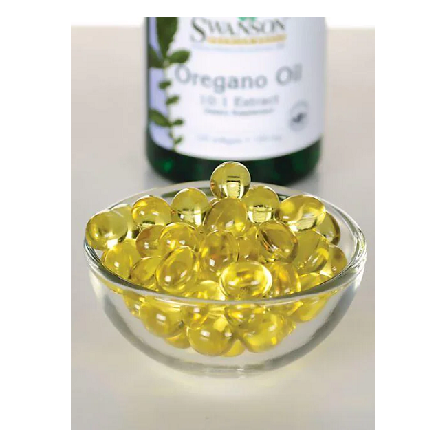 A glass bowl filled with yellow softgel capsules is in front of a Swanson's Oregano Oil 150 mg bottle, which supports the immune system.