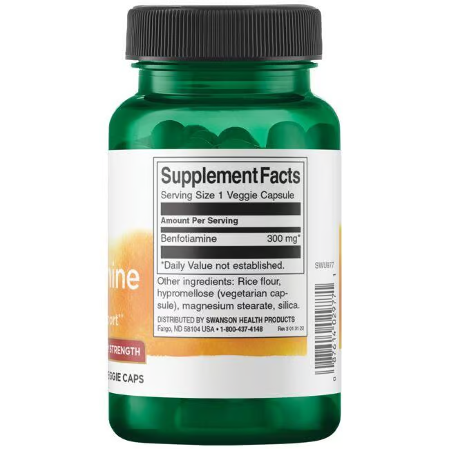 A Swanson green bottle labeled "Benfotiamine (Vitamin B1) 300 mg" features supplement facts, offering 300 mg per serving to support energy production, including ingredients like rice flour and silica.