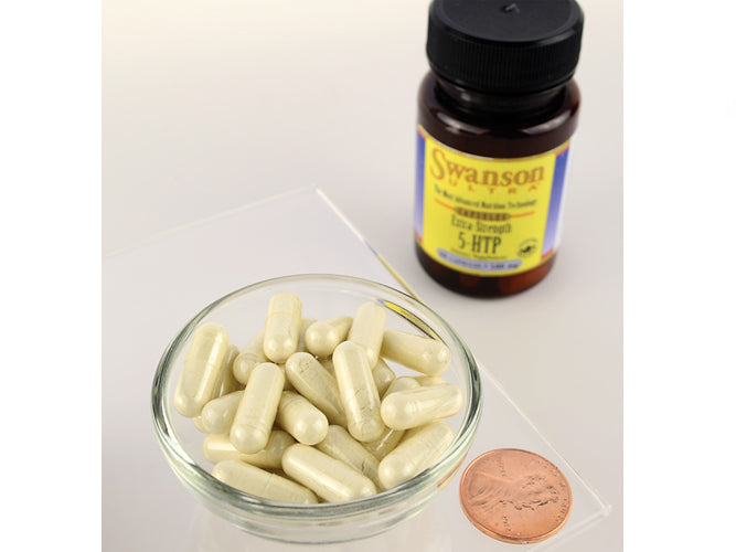 A bottle of Swanson 5-HTP Mood and Stress Support - 50 mg 60 capsules next to a penny.