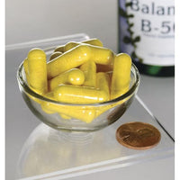 Thumbnail for Vitamin B-50 Complex - 100 capsules in a bowl next to a bottle, promoting nervous system and cardiovascular health. (Swanson)