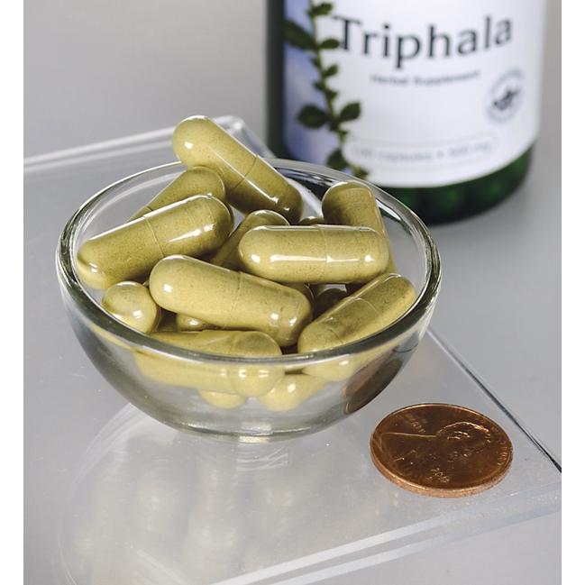 Swanson Triphala with Amla, Behada & Harada - 500 mg 100 capsules, a dietary supplement for maintaining a healthy digestive system, are displayed in a bowl alongside a bottle.