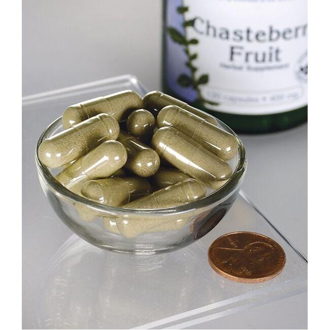 Swanson's Chasteberry Fruit - 400 mg 120 capsules in a bowl on top of a penny.