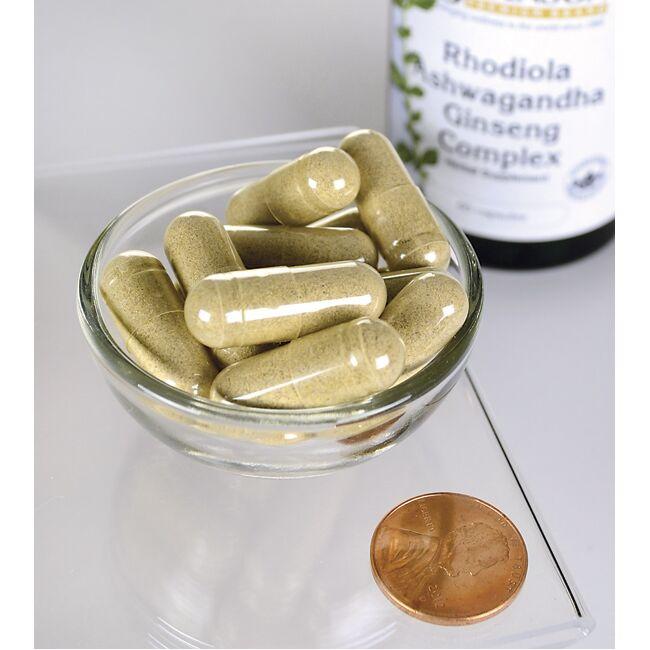 Swanson Adaptogenic Complex Rhodiola, Ashwagandha & Ginseng capsules in a bowl next to a penny.