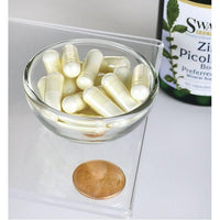 Thumbnail for A bowl of Swanson Zinc Picolinate - 22 mg 60 capsules next to a penny, promoting zinc for immune system and prostate health.