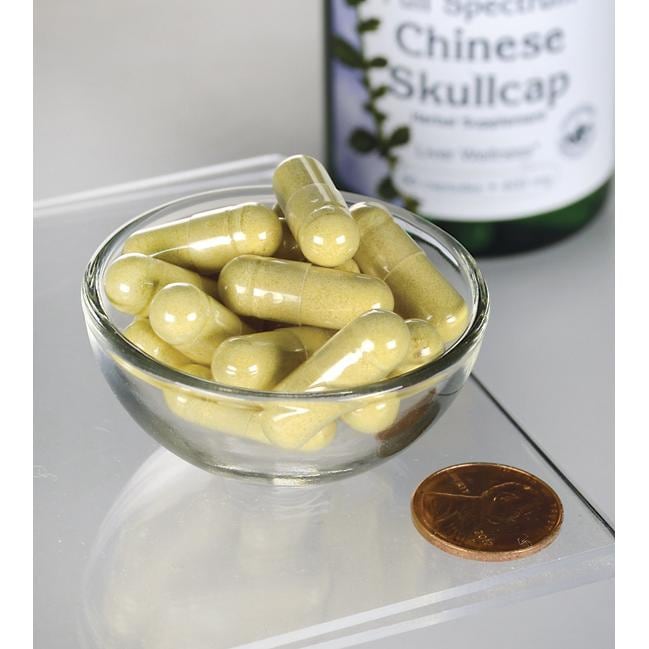 Swanson Chinese Skullcap - 400 mg 90 capsules in a bowl with a penny.