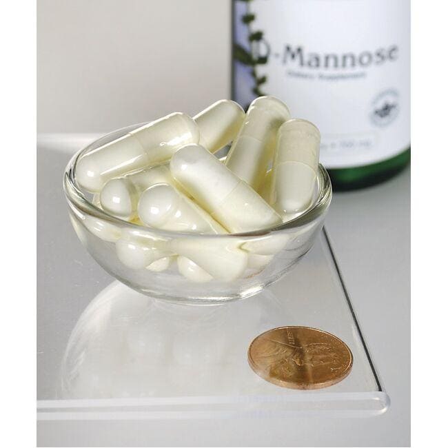 A glass bowl with a bottle of Swanson D-Mannose - 700 mg 60 capsules in it.