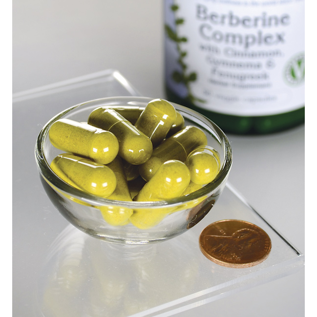 A dietary supplement containing Swanson Berberine Complex with Cinnamon, Gymnema & Fenugreek - 90 vege capsules in a glass bowl.
