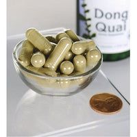 Thumbnail for Swanson Dong Quai - 530 mg 100 capsules in a bowl next to a bottle.