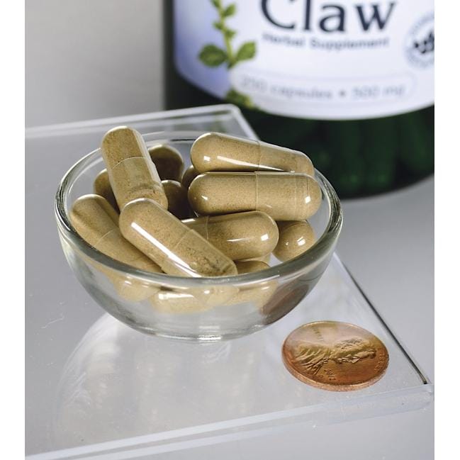 A bowl of Swanson's Cats Claw - 500 mg 250 capsules next to a bottle.