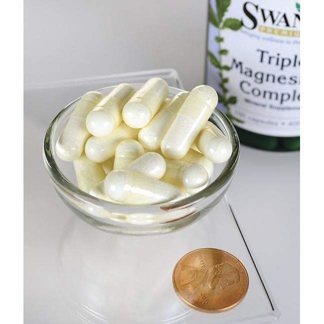 Swanson's Triple Magnesium Complex - 400 mg 100 capsules in a bowl next to a penny, promoting mental relaxation and easing daily stress.