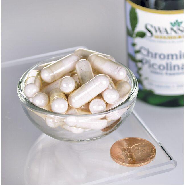 Swanson's Chromium Picolinate - 200 mcg 100 capsules in a bowl next to a penny.