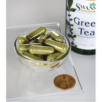 Thumbnail for A bottle of Swanson Green Tea - 500 mg 100 capsules with a penny next to it.