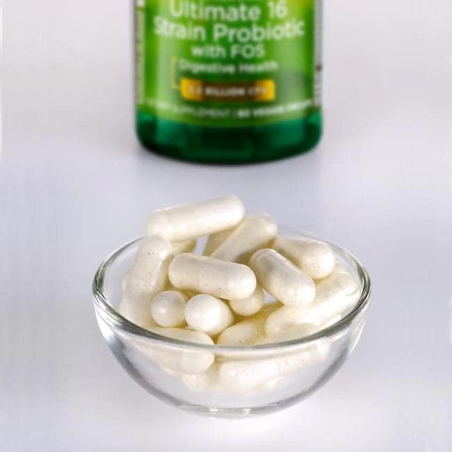 A bottle of Swanson's Dr. Stephen Langer 16 Strain Probiotic with FOS - 60 vege capsules sitting next to a bowl.