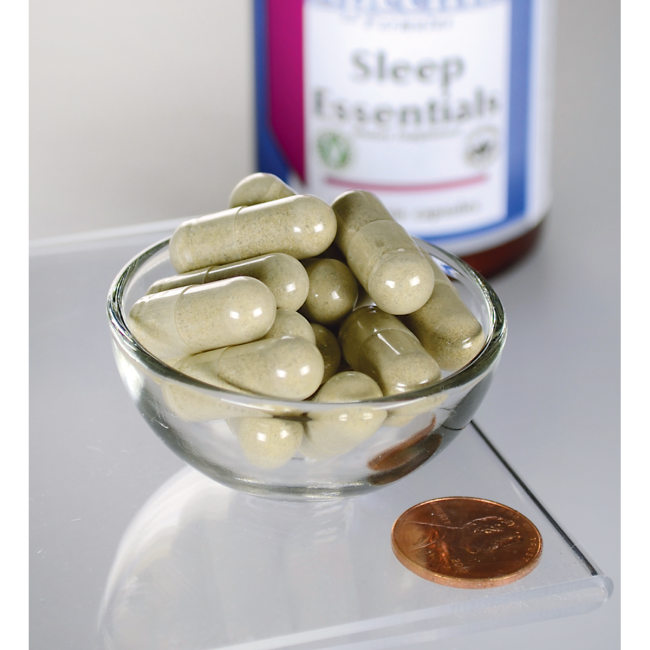 Swanson Sleep Essentials dietary supplement capsules in a bowl.