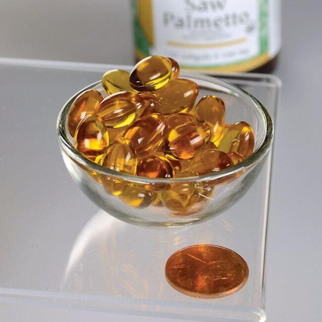 A bowl of Swanson Saw Palmetto - 160 mg 120 softgel next to a penny, promoting prostate health.