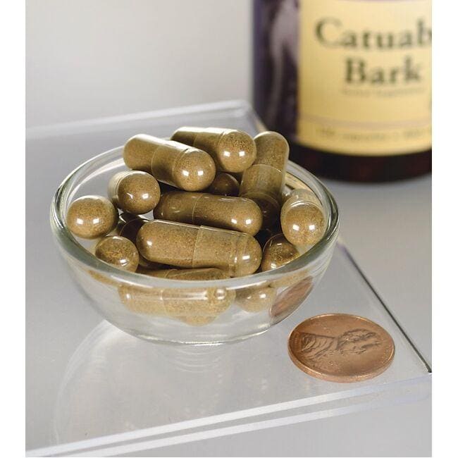 Swanson Catuaba Bark - 465 mg 120 capsules in a bowl next to a bottle.