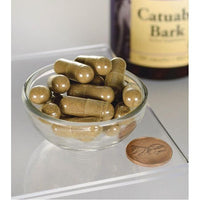Thumbnail for Swanson Catuaba Bark - 465 mg 120 capsules in a bowl next to a bottle.