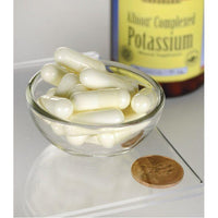 Thumbnail for A bottle of Swanson Potassium - 99 mg 90 capsules Albion Chelated with a coin next to it, promoting the benefits of chelated potassium for the transport of glucose and maintaining healthy blood pressure.