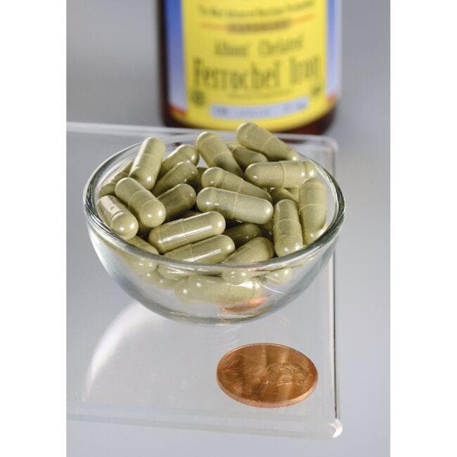 A bowl of greens with Swanson Ferrochel Iron - 18 mg 180 capsules Albion Chelated next to it.