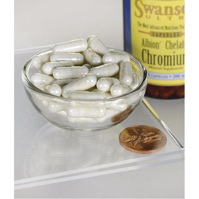 A bowl of Swanson Chromium - 200 mcg 180 capsules Albion Chelated and a penny.