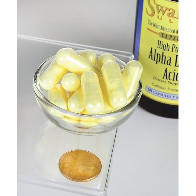 A bottle of Swanson Alpha Lipoic Acid - 600 mg 60 capsules with a coin next to it.
