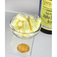 Thumbnail for A bottle of Swanson Alpha Lipoic Acid - 600 mg 60 capsules with a coin next to it.