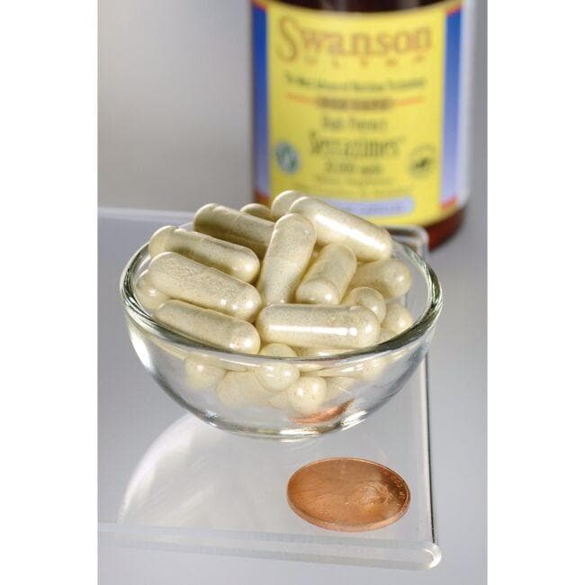 A bowl of Serrazimes - 20000 units 60 vege capsules next to a bottle of Swanson vitamin d supplement for joint health.
