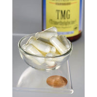 Thumbnail for Swanson TMG Trimethylglycine capsules - 500 mg 90 capsules in a bowl next to a penny, promoting liver function.