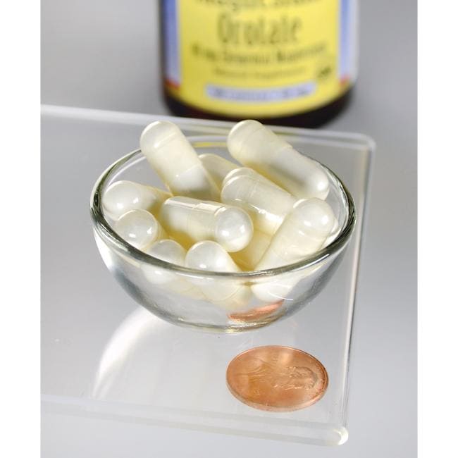 Magnesium Orotate - 40 mg 60 capsules from Swanson in a glass bowl next to a penny.