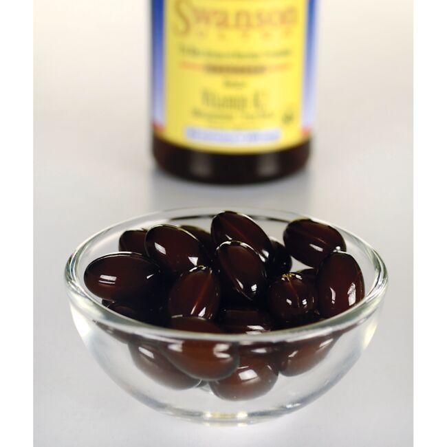Swanson's Vitamin K2 - MK-7 - 100 mcg 30 softgels, known for their high vitamin K2 content, are elegantly displayed in a glass bowl alongside a bottle of nutritious olive oil. This combination promotes healthy bones and helps prevent