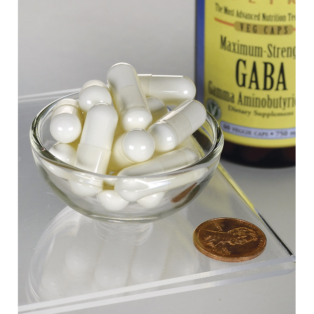 A bowl of Swanson GABA - 750 mg 60 vege capsules next to a bottle of gaba.