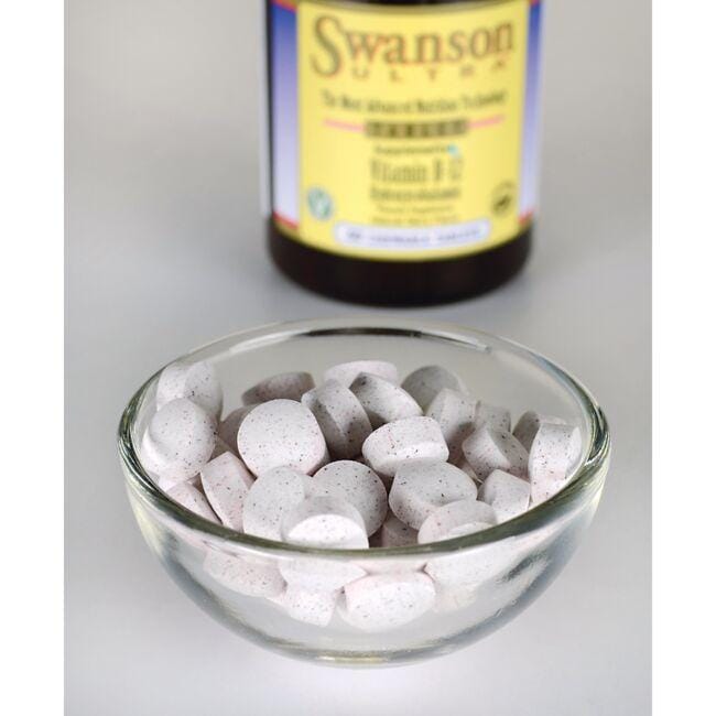 Swanson Vitamin B-12 - 1000 mcg 60 tabs Hydroxycobalamin in a bowl next to a bottle, promoting cardiovascular health with fast absorption.