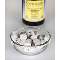 Thumbnail for Swanson Vitamin B-12 - 1000 mcg 60 tabs Hydroxycobalamin in a bowl next to a bottle, promoting cardiovascular health with fast absorption.