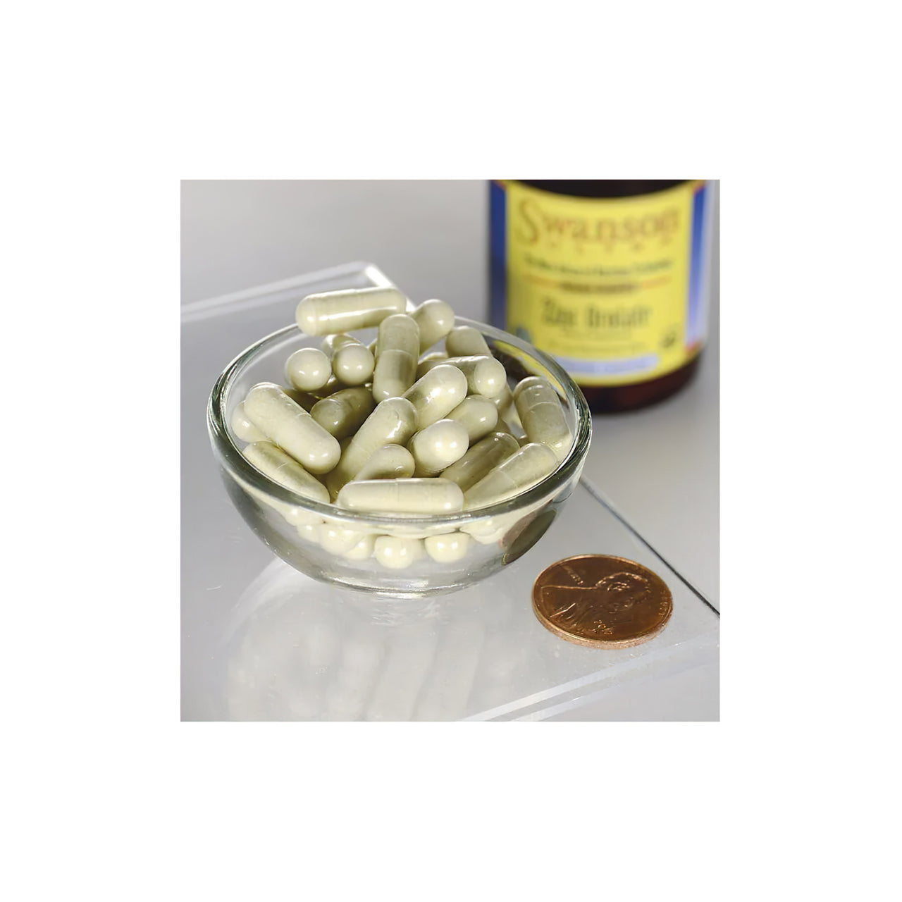 A bowl of Swanson Zinc Orotate 10 mg 60 veg caps next to a bottle of orotic acid pills with high-bioavailability mineral salt.