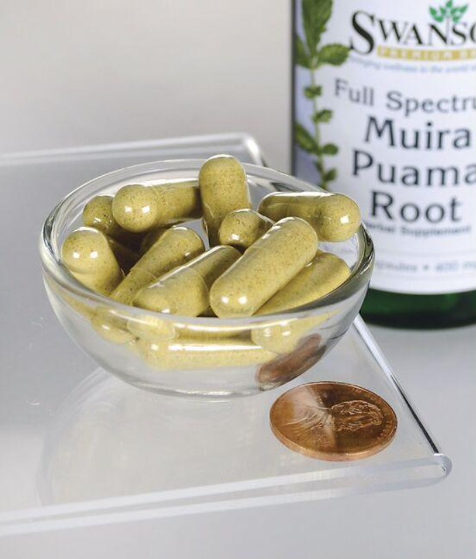 A bottle of Swanson Full Spectrum Muira Puama - 400 mg 90 capsules with a penny next to it.