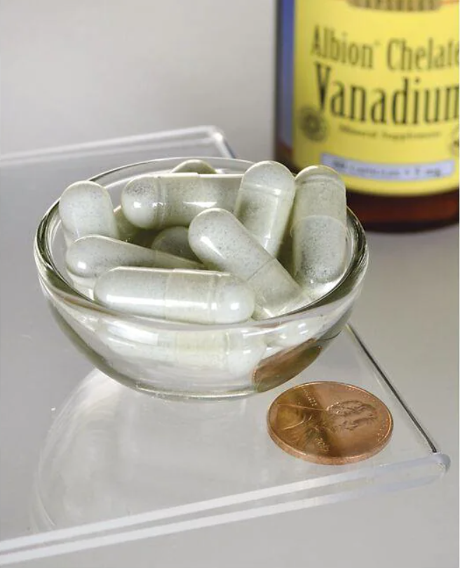 A bowl of Swanson Albion Vanadium Chelated - 5 mg 60 capsules next to a bottle of alcohol.